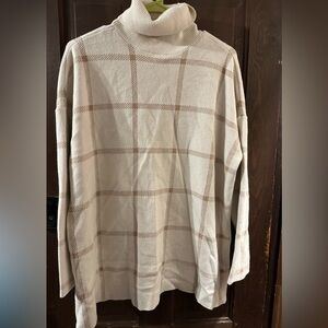 And Taylor Cowell, neck, cream and tan side slit sweater